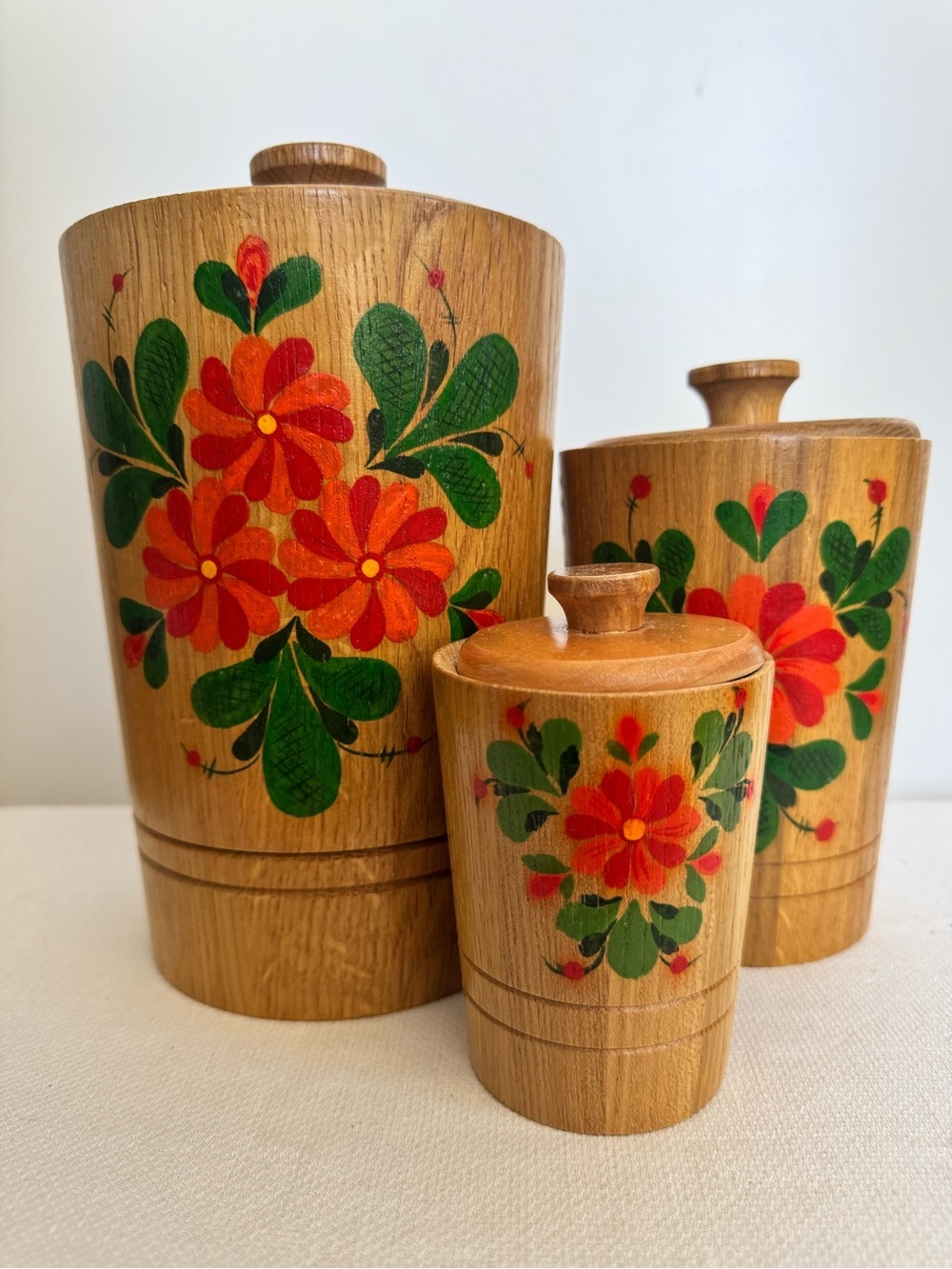 Set of 3 hand-painted wooden canisters with floral decoration made in the USSR